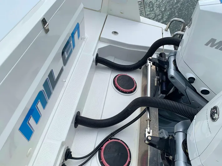  Yacht Photos Pics Hussar Skamander 920 Explorer MAX 2022 boat engine area with hoses and branding.