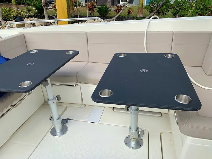  Yacht Photos Pics Hussar Skamander 920 Explorer MAX 2022 boat interior with dual tables and seating.