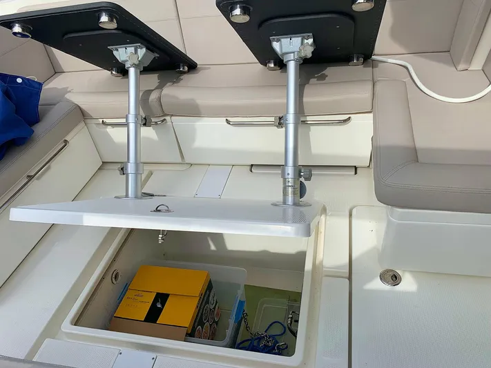  Yacht Photos Pics Hussar Skamander 920 Explorer MAX 2022 boat interior storage compartment with seating and table.