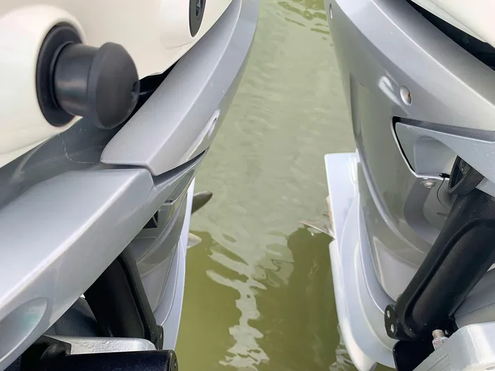  Yacht Photos Pics Close-up of 2022 Hussar Skamander 920 Explorer MAX boat engines on water.