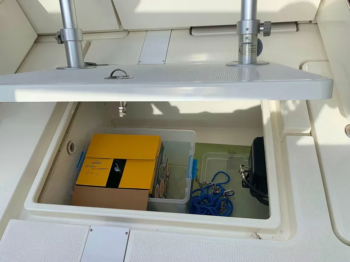  Yacht Photos Pics Storage compartment of 2022 Hussar Skamander 920 Explorer MAX with boxes and ropes.