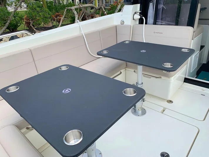  Yacht Photos Pics Hussar Skamander 920 Explorer MAX 2022 boat interior with dual tables and seating.