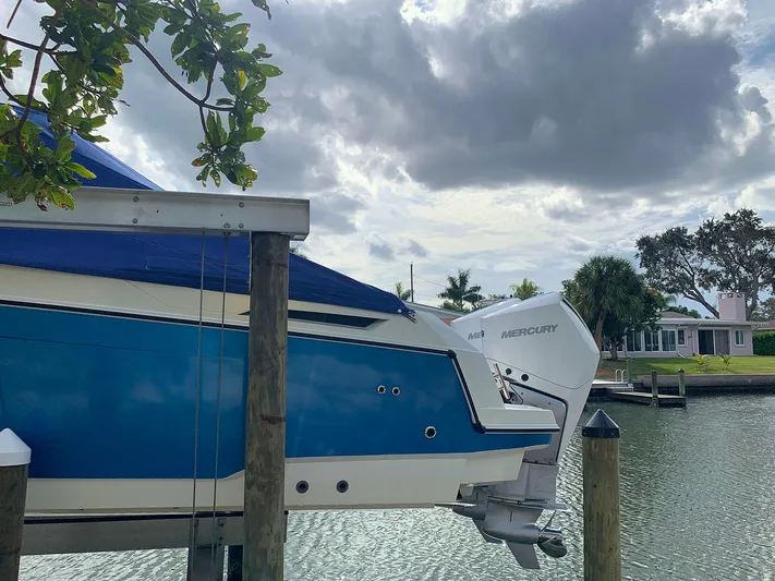  Yacht Photos Pics 2022 Parker Poland Hussar Skamander 920 Explorer MAX docked by a scenic waterfront.
