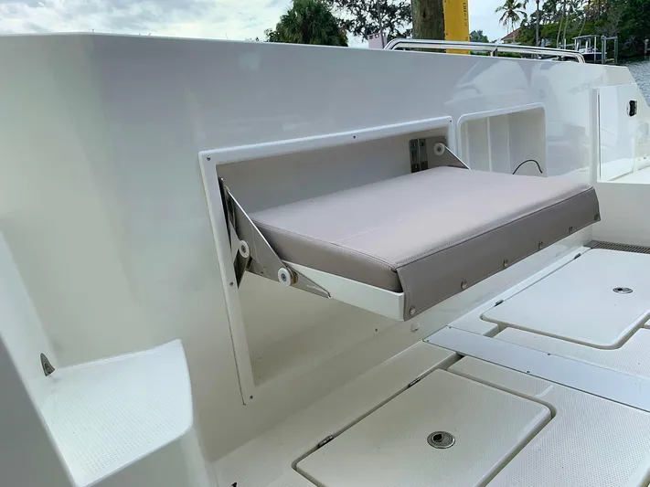  Yacht Photos Pics Hussar Skamander 920 Explorer MAX 2022 boat with foldable seat on deck.