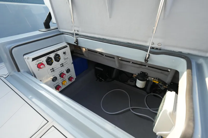  Yacht Photos Pics 2025 Ranieri Cayman 33 Executive boat control panel and storage compartment.