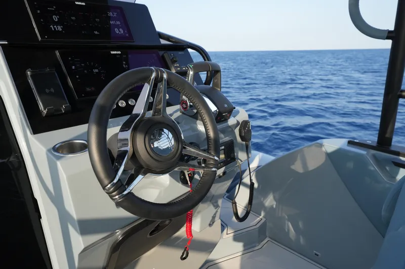  Yacht Photos Pics 2025 Ranieri Cayman 33 Executive boat steering console with ocean view.