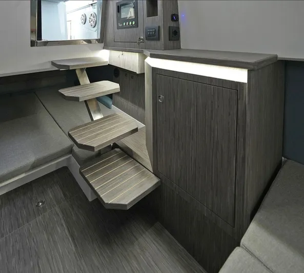  Yacht Photos Pics Interior of 2025 Ranieri Cayman 33 Executive yacht with modern wooden steps and cabinetry.