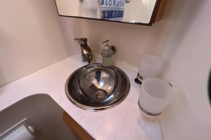 Evolution Yacht Photos Pics Stainless steel sink in Privilege 495 yacht bathroom, 2011 model.