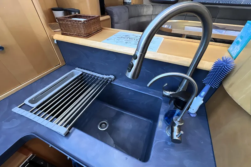 Evolution Yacht Photos Pics Modern kitchen sink with stainless steel faucet in 2011 Privilege 495 yacht.