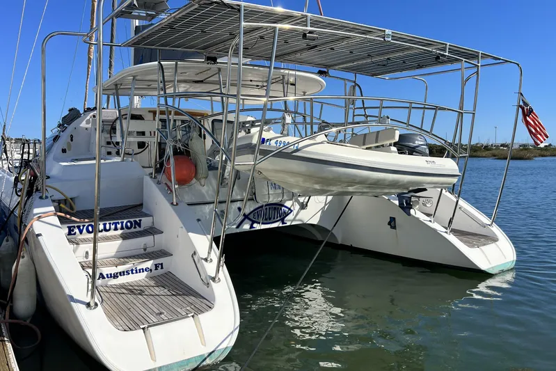 Evolution Yacht Photos Pics Catamaran Privilege 495, 2011 model, docked with dinghy, St. Augustine, Florida.