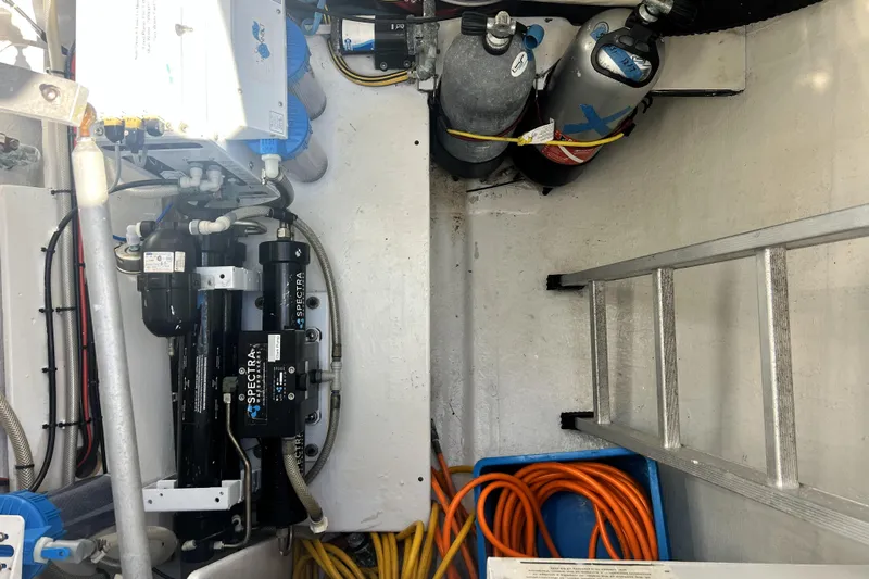 Evolution Yacht Photos Pics Engine room of 2011 Privilege 495 yacht with equipment and storage.