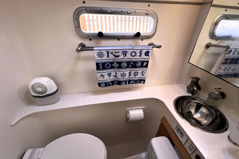 Evolution Yacht Photos Pics Compact marine bathroom in 2011 Privilege 495 yacht with nautical decor.