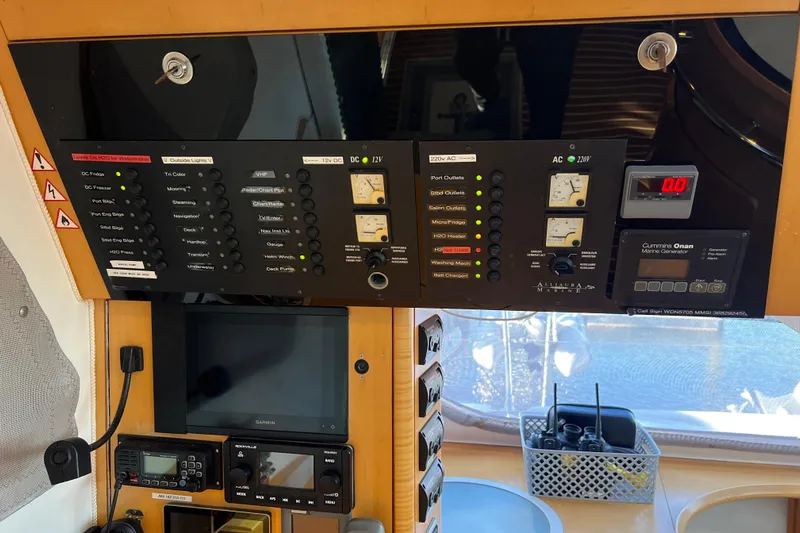 Evolution Yacht Photos Pics Control panel of a 2011 Privilege 495 yacht with various switches and gauges.