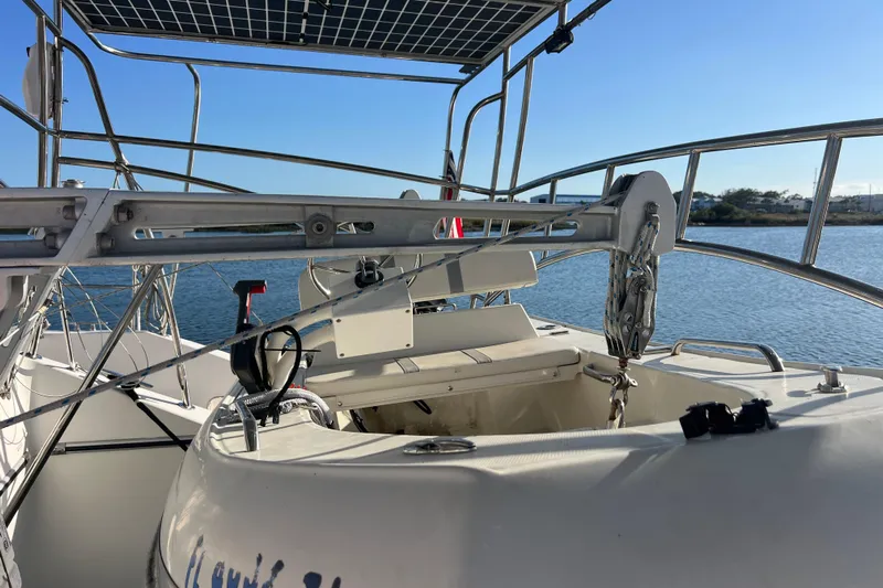 Evolution Yacht Photos Pics Sailing yacht Privilege 495, 2011 model, featuring deck and solar panel, docked by the water.