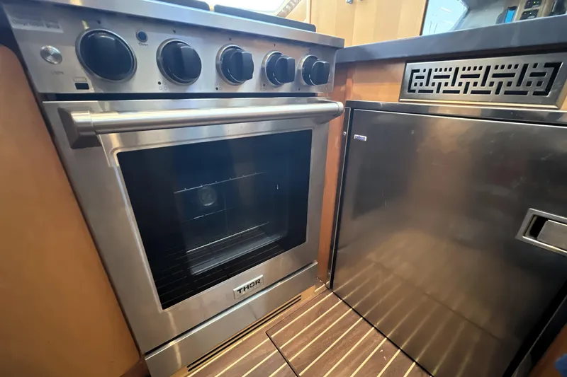 Evolution Yacht Photos Pics Stainless steel oven and fridge in a Privilege 495 yacht kitchen, 2011 model.