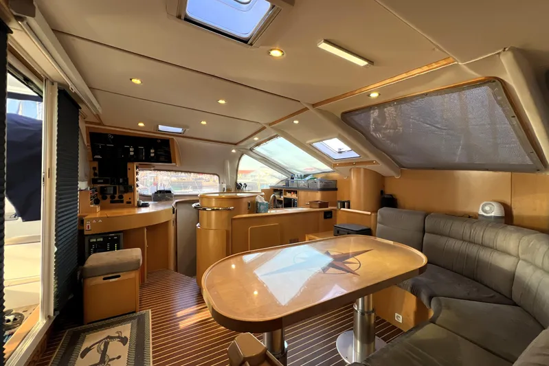 Evolution Yacht Photos Pics Luxurious interior of 2011 Privilege 495 yacht with modern seating and navigation area.