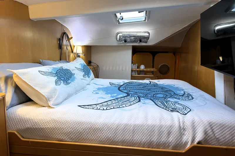 Evolution Yacht Photos Pics Cozy cabin bedroom in 2011 Privilege 495 yacht with turtle-themed bedding.