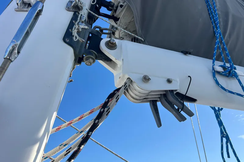 Evolution Yacht Photos Pics Close-up of a 2011 Privilege 495 sailboat mast and rigging against a clear blue sky.
