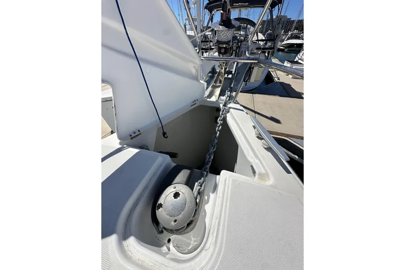 Jenni Yacht Photos Pics 2015 Jeanneau Sun Odyssey 409 anchor chain and windlass in marina setting.