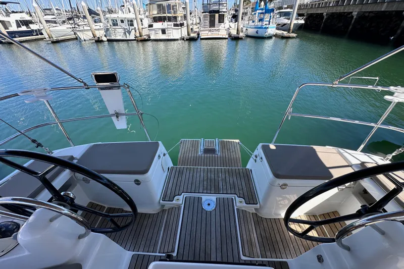Jenni Yacht Photos Pics Cockpit view of 2015 Jeanneau Sun Odyssey 409 sailboat docked at marina.