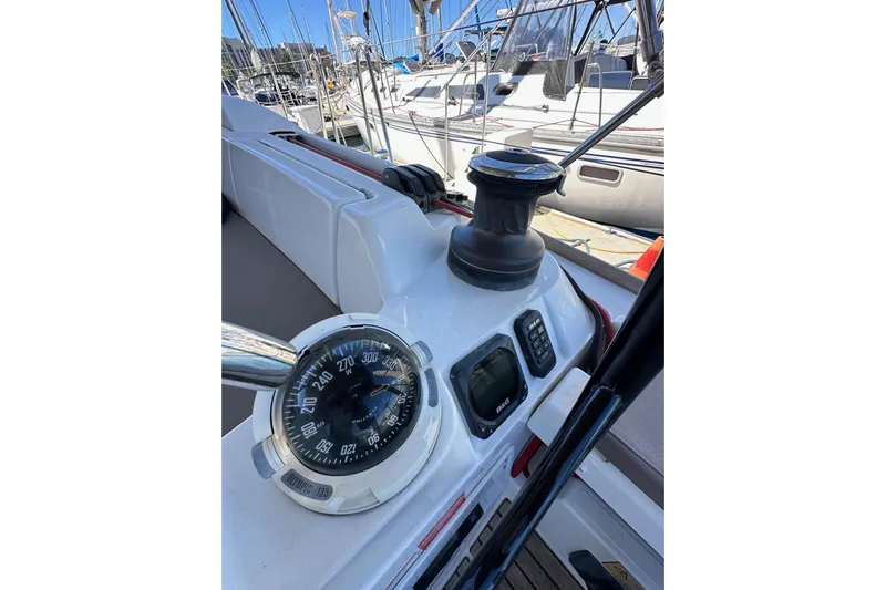 Jenni Yacht Photos Pics Cockpit of 2015 Jeanneau Sun Odyssey 409 sailboat with compass and winch.