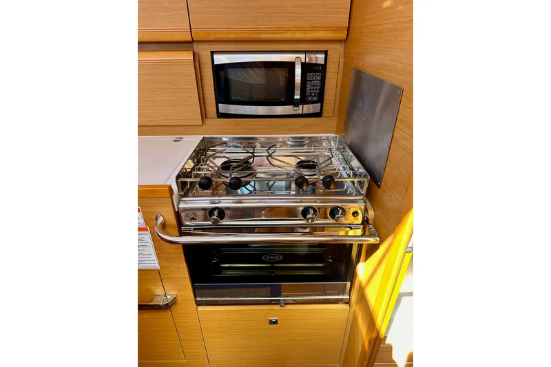 Jenni Yacht Photos Pics Galley kitchen in 2015 Jeanneau Sun Odyssey 409 with stove and microwave.