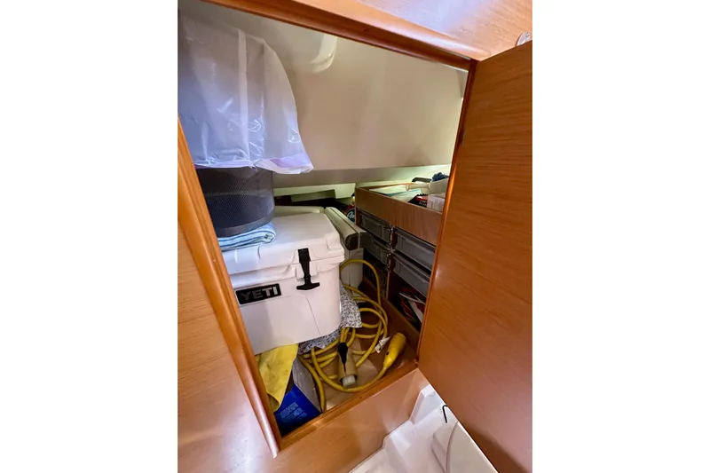 Jenni Yacht Photos Pics Storage compartment on 2015 Jeanneau Sun Odyssey 409 yacht with cooler and equipment.