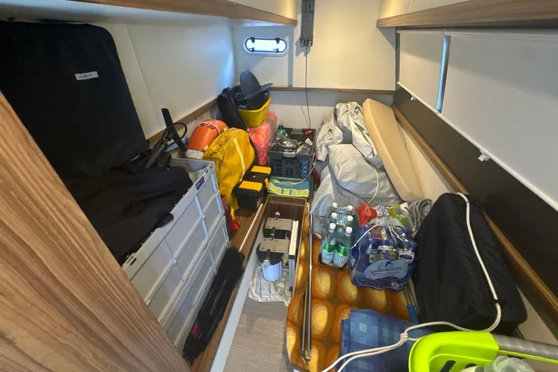  Yacht Photos Pics Storage area in a 2017 Absolute 60 Fly yacht, filled with supplies and equipment.