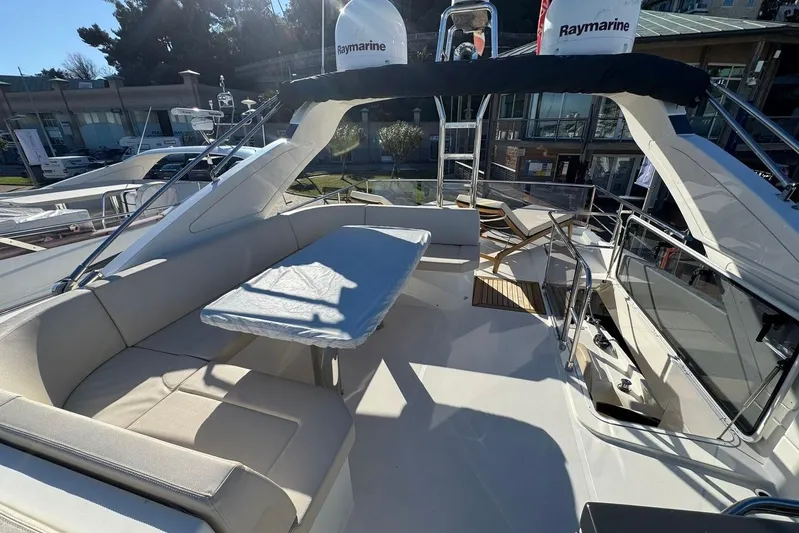 Yacht Photos Pics Luxurious 2017 Absolute 60 Fly yacht with spacious outdoor seating and table.