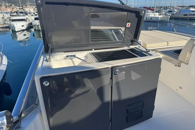  Yacht Photos Pics Outdoor grill on 2017 Absolute 60 Fly yacht, docked at marina.