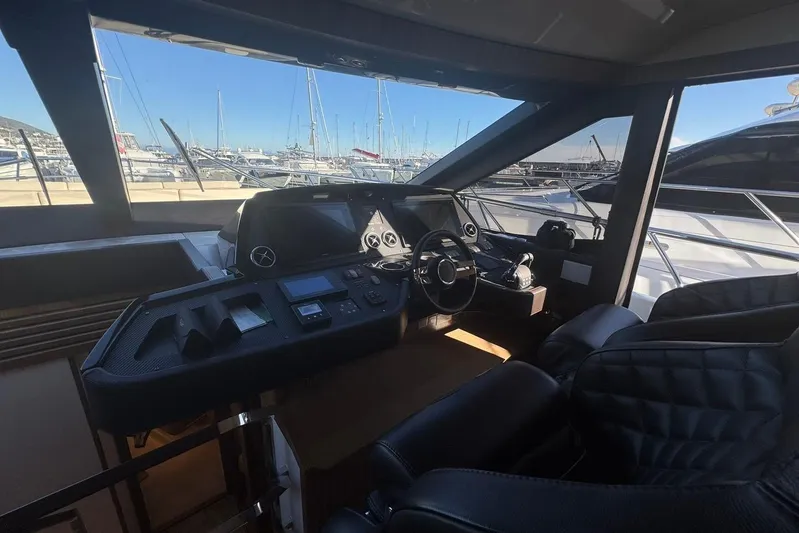  Yacht Photos Pics Luxurious helm of 2017 Absolute 60 Fly yacht with marina view.