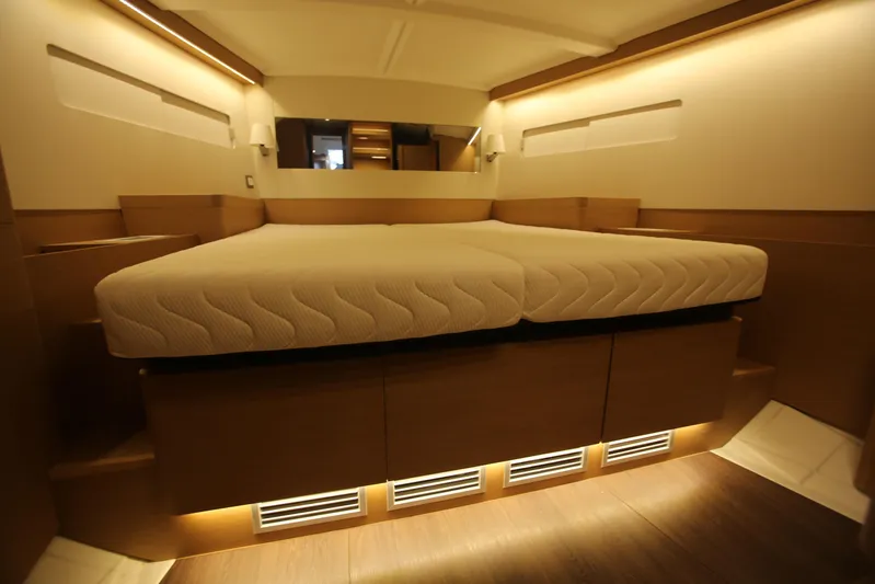 Valinore Yacht Photos Pics Luxurious cabin interior of 2023 Jeanneau Sun Odyssey 490 yacht with modern lighting.