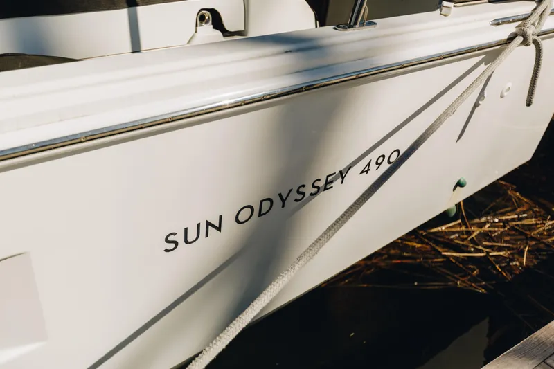 Valinore Yacht Photos Pics 2023 Jeanneau Sun Odyssey 490 sailboat, docked with visible name and rope.