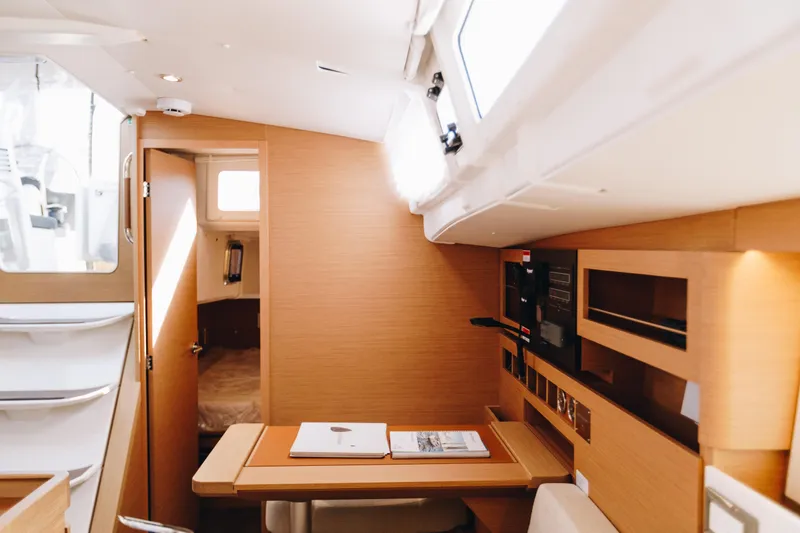 Valinore Yacht Photos Pics Interior of 2023 Jeanneau Sun Odyssey 490 yacht, featuring modern wood finishes and ample natural light.