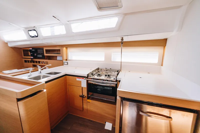 Valinore Yacht Photos Pics Modern kitchen interior of 2023 Jeanneau Sun Odyssey 490 yacht.