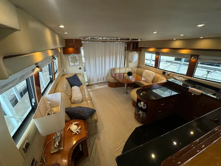 Cloud 9 Yacht Photos Pics Luxurious interior of a 2004 Carver 56 Voyager yacht with elegant seating and decor.