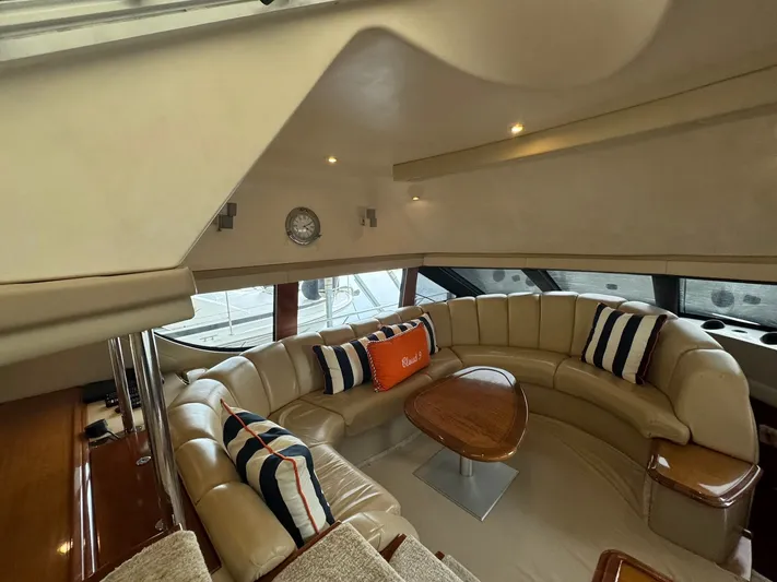 Cloud 9 Yacht Photos Pics Luxurious interior of 2004 Carver 56 Voyager yacht with plush seating and elegant decor.