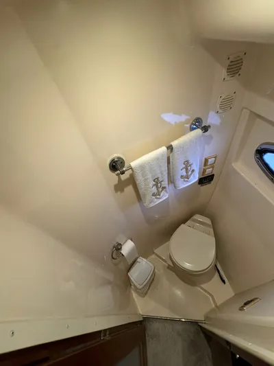 Cloud 9 Yacht Photos Pics 2004 Carver 56 Voyager bathroom with anchor-themed towels and compact design.