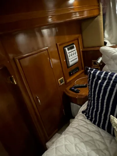 Cloud 9 Yacht Photos Pics Interior of 2004 Carver 56 Voyager yacht with wood paneling and control panel.
