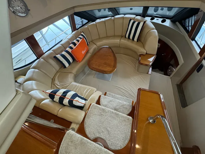 Cloud 9 Yacht Photos Pics Luxurious interior of 2004 Carver 56 Voyager yacht with plush seating and elegant decor.