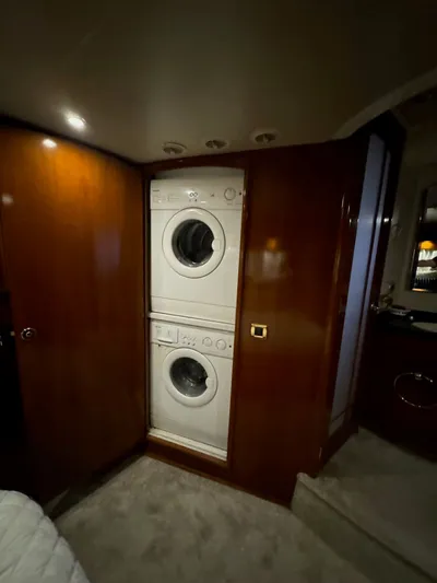 Cloud 9 Yacht Photos Pics Stacked washer and dryer in 2004 Carver 56 Voyager yacht interior.