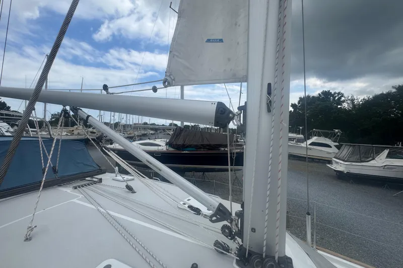 True Love Yacht Photos Pics 2005 Catalina Morgan 440 DS sailboat docked at marina under cloudy sky.