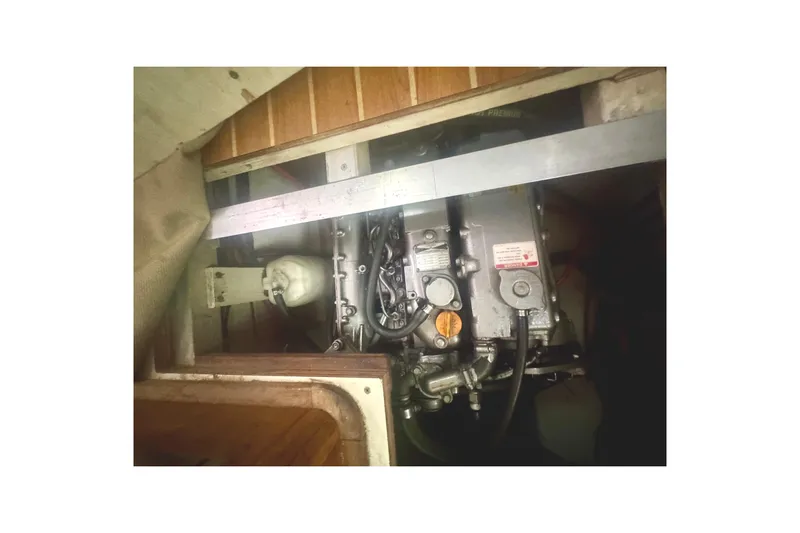 True Love Yacht Photos Pics Engine compartment of 2005 Catalina Morgan 440 DS sailboat, showcasing mechanical components.