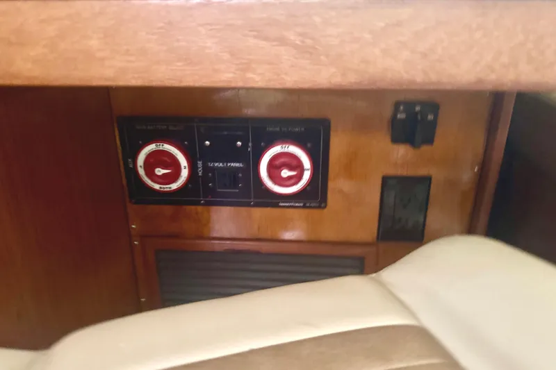 True Love Yacht Photos Pics Control panel inside 2005 Catalina Morgan 440 DS yacht, featuring switches and dials.