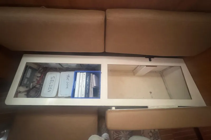 True Love Yacht Photos Pics Storage compartment in 2005 Catalina Morgan 440 DS sailboat with manuals and equipment.