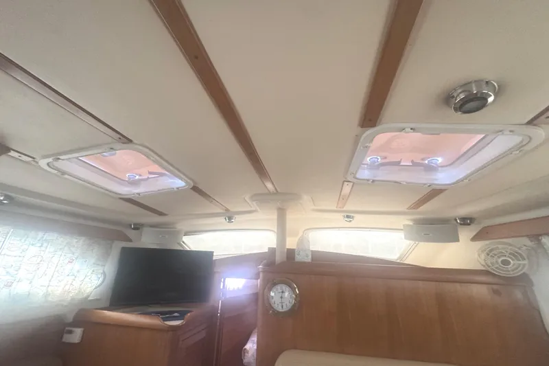 True Love Yacht Photos Pics Interior of 2005 Catalina Morgan 440 DS sailboat with ceiling hatches and wooden accents.