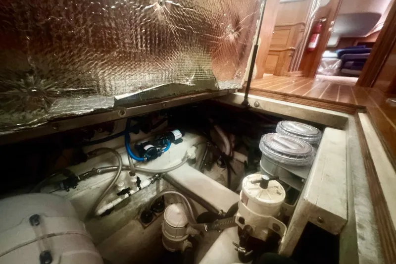 True Love Yacht Photos Pics Engine compartment of a 2005 Catalina Morgan 440 DS sailboat, showcasing mechanical components.