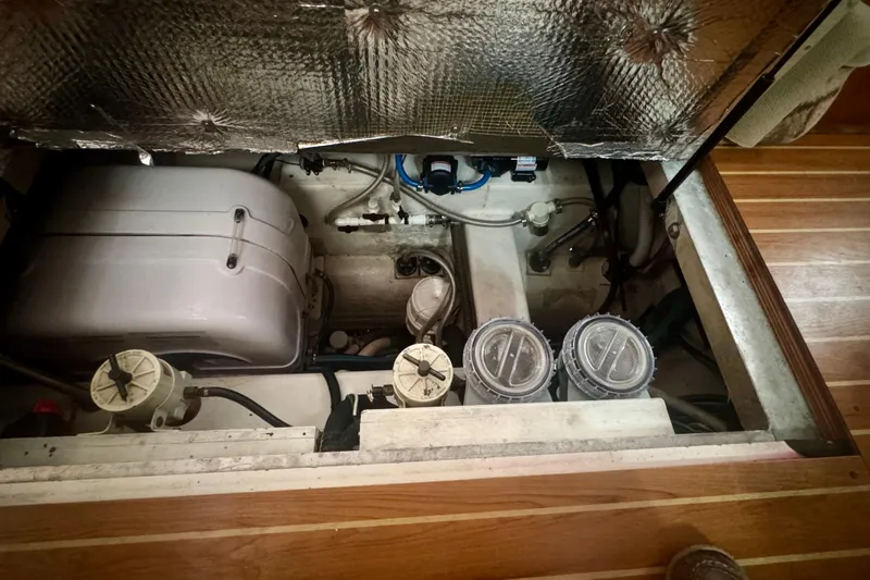 True Love Yacht Photos Pics Engine compartment of 2005 Catalina Morgan 440 DS sailboat, showcasing mechanical components and insulation.