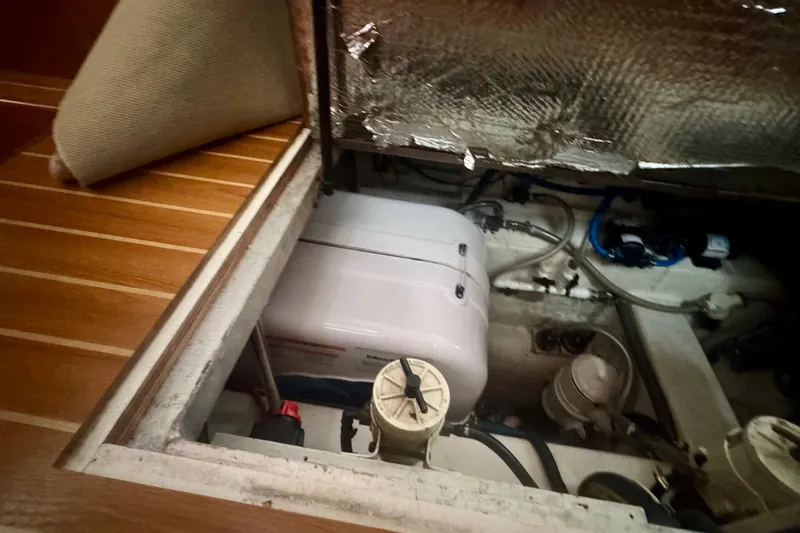 True Love Yacht Photos Pics Engine compartment of a 2005 Catalina Morgan 440 DS sailboat, showcasing mechanical components.