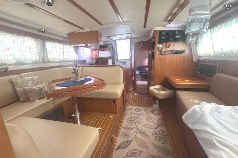 True Love Yacht Photos Pics Interior of 2005 Catalina Morgan 440 DS yacht with cozy seating and wooden accents.